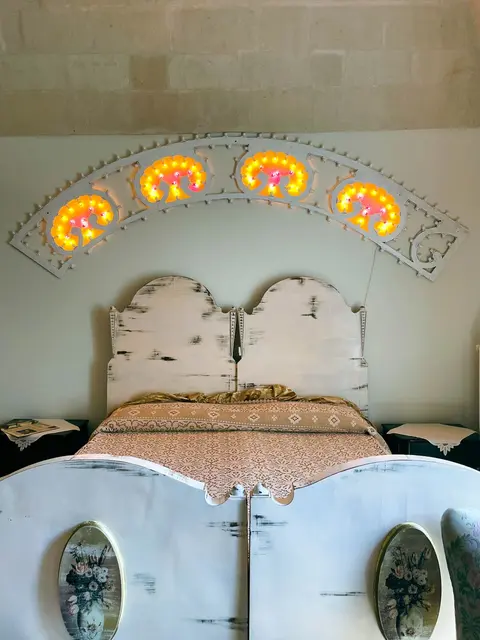 Camera Borghese ‘950 — Bed with festival lights