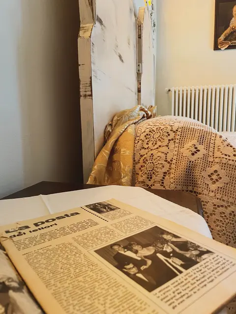Camera Borghese ‘950 — Newspaper on the bedspread